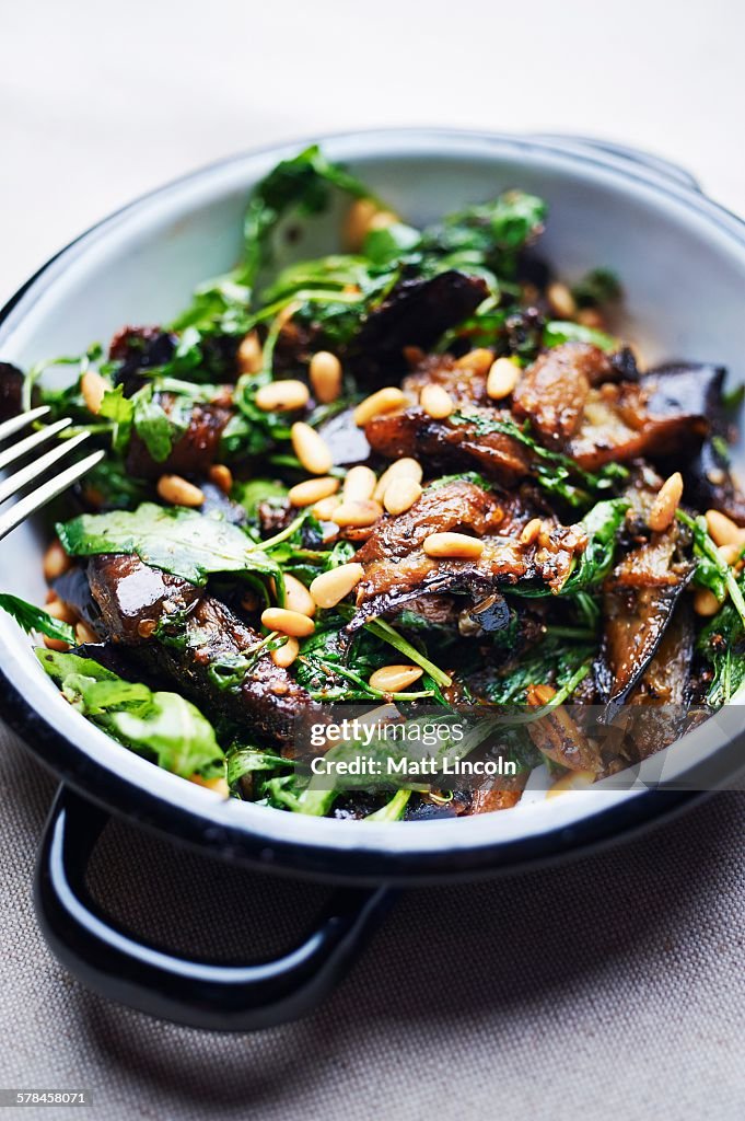 Aubergine with pine nuts and spinach, close-up