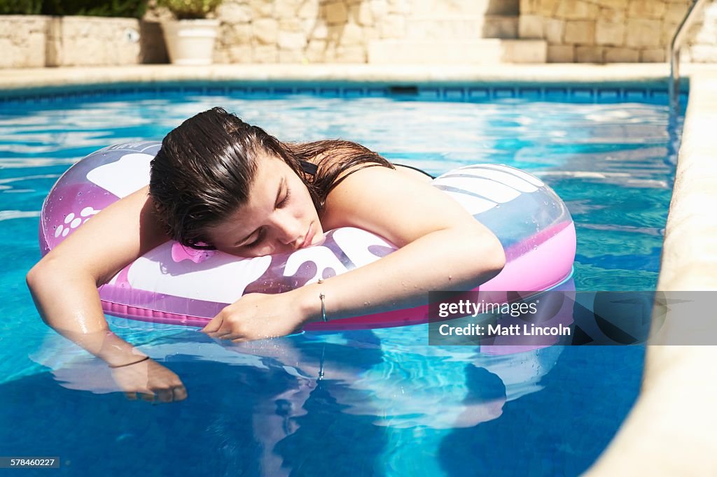 Tween Floating Inpool Teenage Girl Floating On Inflatable In Swimming Pool High-Res Stock ...
