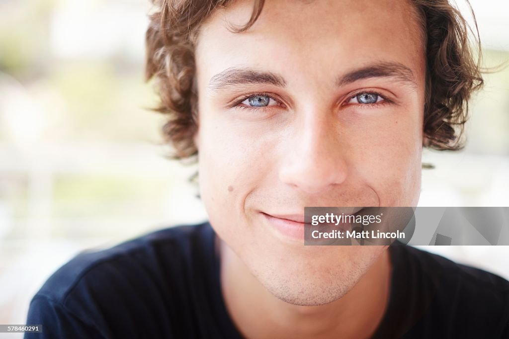 Close up portrait of young man with blue eyes