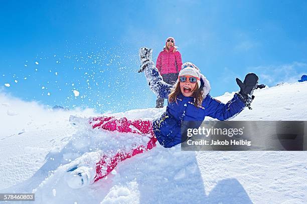 girl falling into snow, chamonix, france - family fun snow stock pictures, royalty-free photos & images