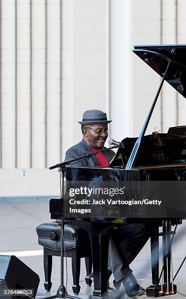 American Jazz musician Andy Bey plays piano as he performs on the second day of the 23rd Annual Charlie Parker Jazz Festival in the Richard Rodgers...