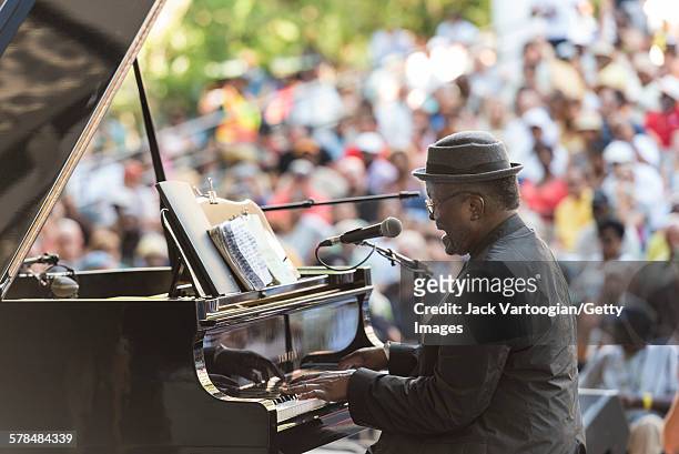 American Jazz musician Andy Bey plays piano as he performs on the second day of the 23rd Annual Charlie Parker Jazz Festival in the Richard Rodgers...