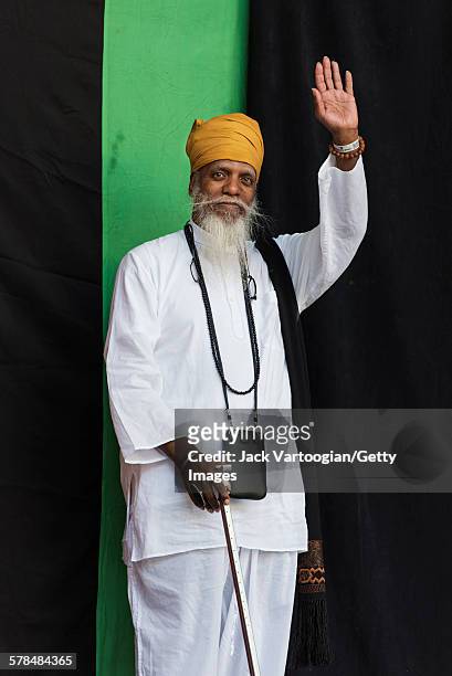 American Jazz musician Dr Lonnie Smith waves as he enters the stage to headline the second day of the 23rd Annual Charlie Parker Jazz Festival in the...