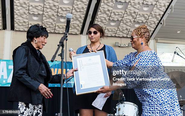 Ninty-five year-old American Lindy Hop dancer Norma Miller receives a proclamation from Diana Howard , of Manhattan Borough President Gale Brewer's...