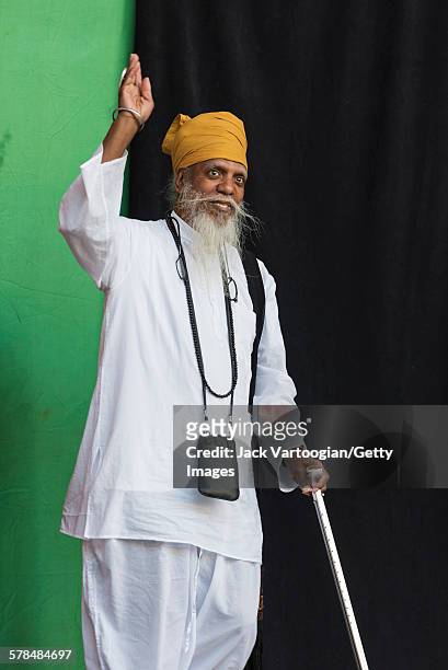 American Jazz musician Dr Lonnie Smith waves as he enters the stage to headline the second day of the 23rd Annual Charlie Parker Jazz Festival in the...