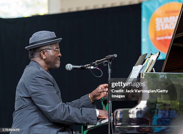 American Jazz musician Andy Bey plays piano as he performs on the second day of the 23rd Annual Charlie Parker Jazz Festival in the Richard Rodgers...