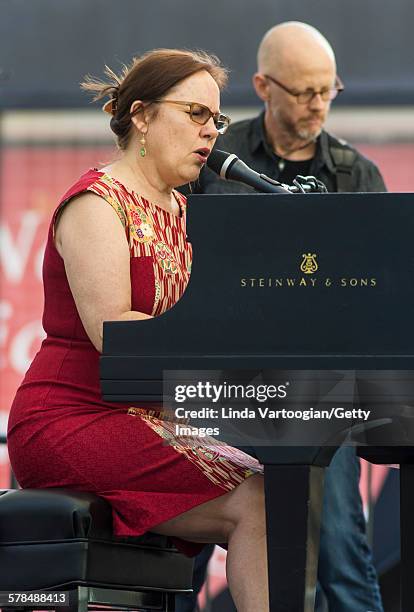 American Country and Folk musician Iris DeMent plays piano with her band with at the Lincoln Center Out of Doors Americanafest NYC on Hearst Plaza,...