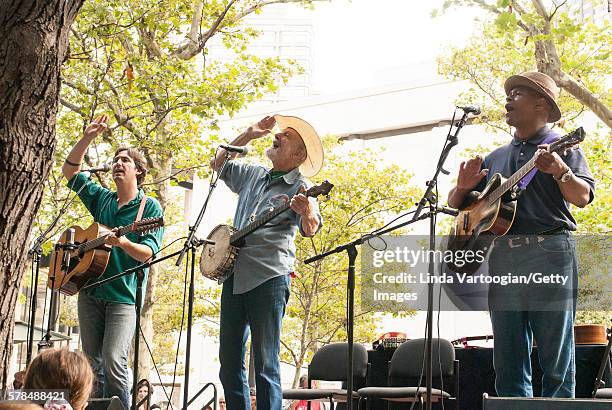 American musician Pete Seeger plays on banjo, with his grandson, Tao Rodriguez Seeger , on 12-string guitar, and Guy Davis, on guitar, on the South...