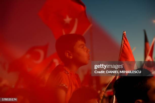 Erdogan supporters gather at Taksim square on July 21, 2016 during a rally in Istanbul, following the failed military coup attempt of July 15. Turkey...