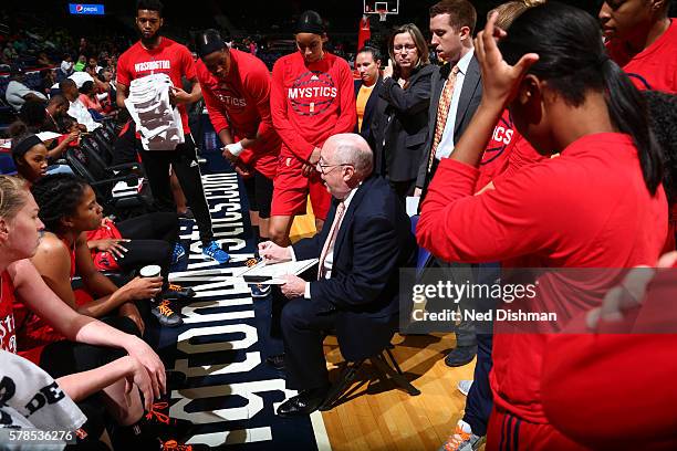 Head coach, Mike Thibault of the Washington Mystics huddles after a play against the San Antonio Stars on June 29, 2016 at the Verizon Center in...