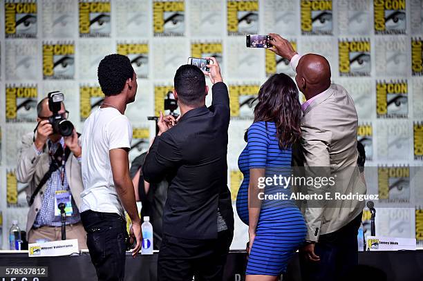 Actors Tyler James Williams, Wilmer Valderrama and Daniela Ruah, and moderator Kevin Frazier take selfies at CBS Television Studios Block including...