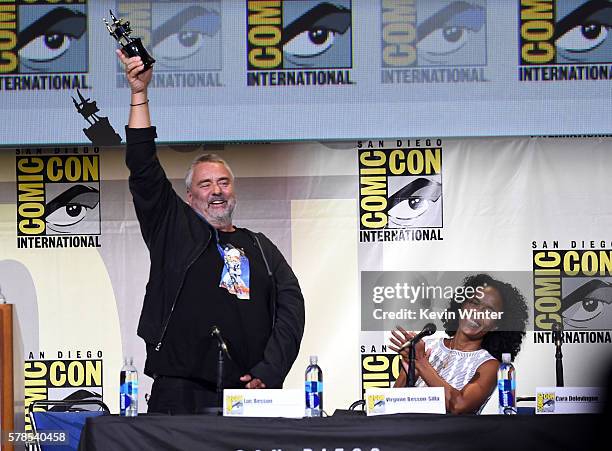 Director Luc Besson with award and producer Virginie Besson-Silla attend the "Valerian And The City Of A Thousand Planets" panel during Comic-Con...