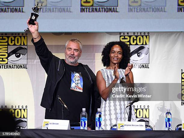 Director Luc Besson with award and producer Virginie Besson-Silla attend the "Valerian And The City Of A Thousand Planets" panel during Comic-Con...