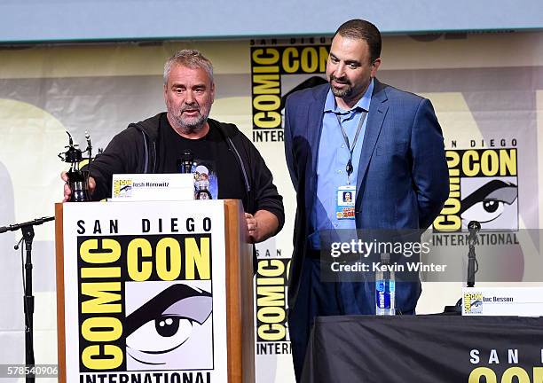 Director Luc Besson accepts Inkpot Award from Comic-Con International Director of Programming Eddie Ibrahim at the "Valerian And The City Of A...