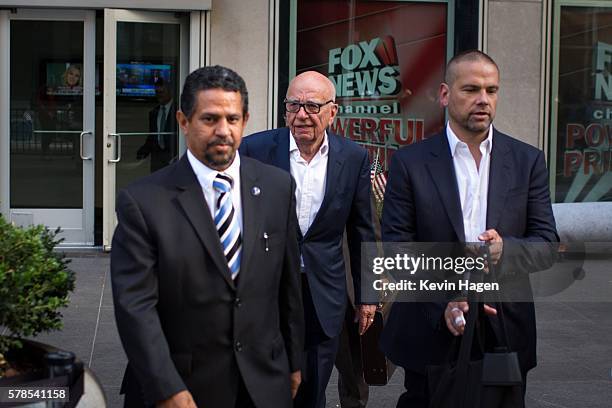 Rupert Murdoch leaves the News Corporation building with his son Lachlan Murdoch on July 21, 2016 in New York City. Rupert Murdoch is taking over as...