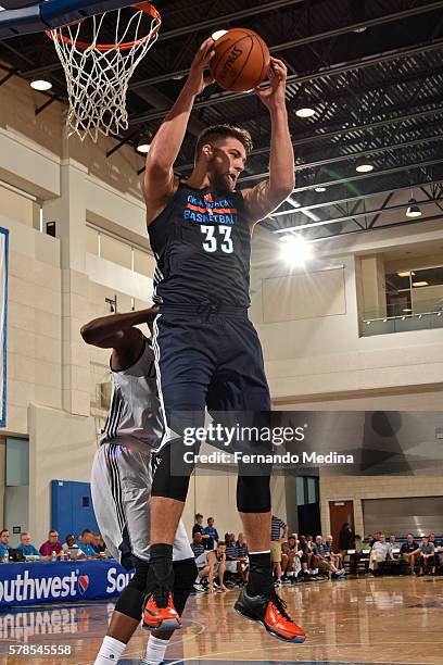 Mitch McGary of the Oklahoma City Thunder grabs the rebound against the Dallas Mavericks during the 2016 Orlando Summer League on July 2, 2016 at...