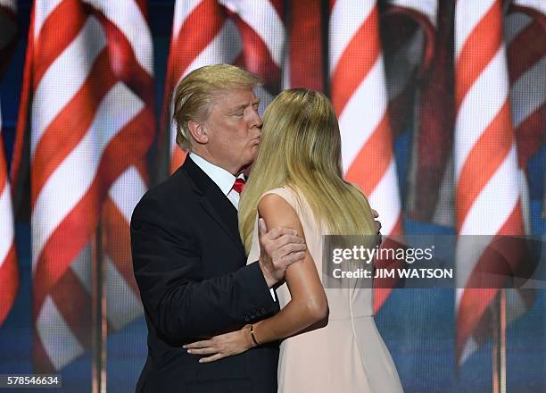 Republican presidential candidate Donald Trump kisses his daughter Ivanka Trump as he enters the stage on the last day of the Republican National...