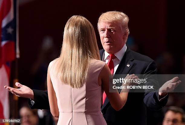 Republican presidential candidate Donald Trump kisses his daughter Ivanka Trump as he enters the stage on the last day of the Republican National...