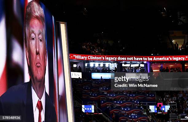 Screen displays Republican presidential candidate Donald Trump delivering his speech during the evening session on the fourth day of the Republican...