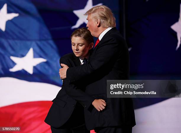 Republican presidential candidate Donald embraces his son Barron Trump after he delivered his speech on the fourth day of the Republican National...