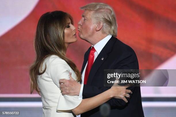 Republican presidential candidate Donald Trump kisses his wife Melania on the final night of the Republican National Convention at the Quicken Loans...