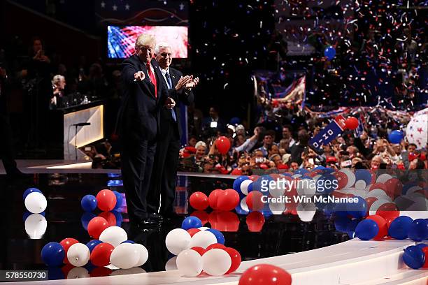Republican presidential candidate Donald Trump and Republican vice presidential candidate Mike Pence acknowledge the crowd at the end of the...