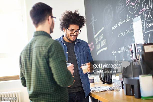 young business people having coffee break - 2 men chatting casual office stock pictures, royalty-free photos & images