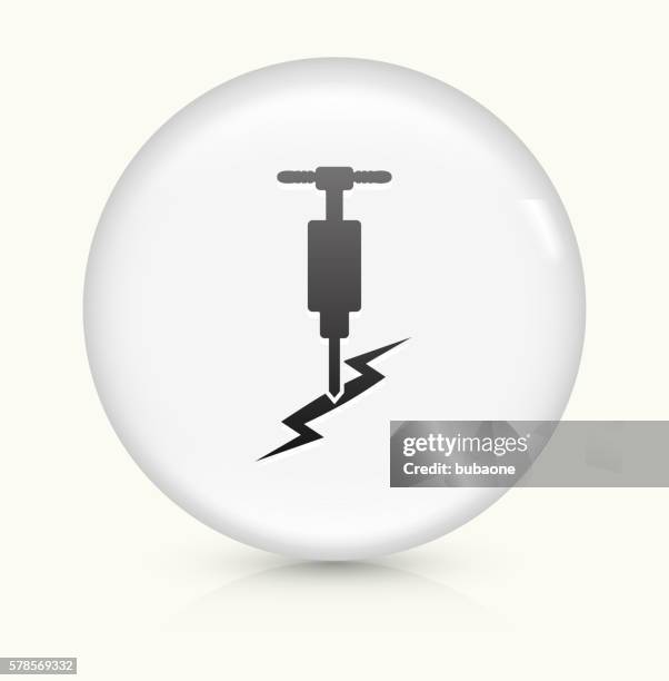 jackhammer icon on white round vector button - cracked asphalt stock illustrations