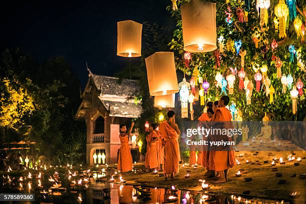 monks at phan tao temple during the loi krathong festival - loi krathong stock pictures, royalty-free photos & images