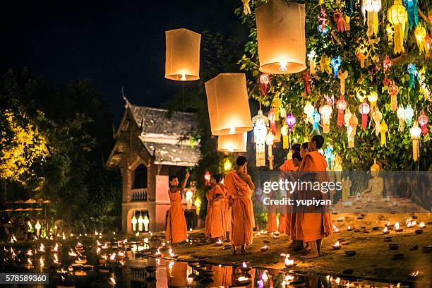 monks at phan tao temple during the loi krathong festival - chiang mai province stock pictures, royalty-free photos & images