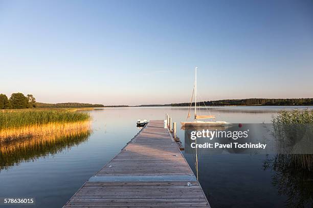 small pier in masuria lake district region - masuria stock-fotos und bilder