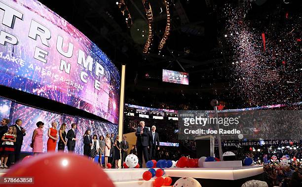 Republican presidential candidate Donald Trump and Republican vice presidential candidate Mike Pence acknowledge the crowd with their familes at the...