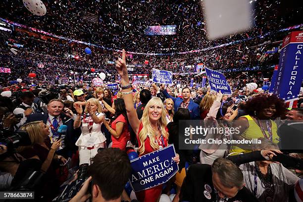 Delegates stand and cheer at the end of the Republican National Convention on July 21, 2016 at the Quicken Loans Arena in Cleveland, Ohio. Republican...