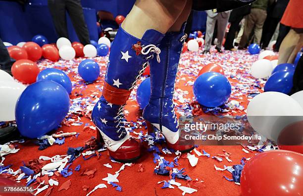 An attendee stands amongst balloons at the end of the fourth day of the Republican National Convention on July 21, 2016 at the Quicken Loans Arena in...
