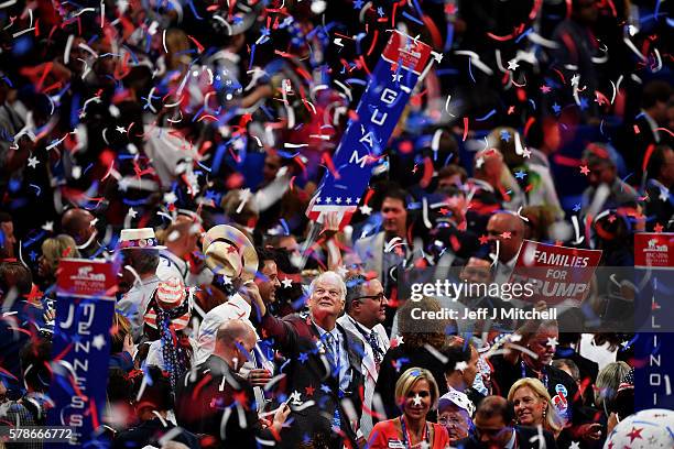 Delegates stand and cheer at the end of the Republican National Convention on July 21, 2016 at the Quicken Loans Arena in Cleveland, Ohio. Republican...