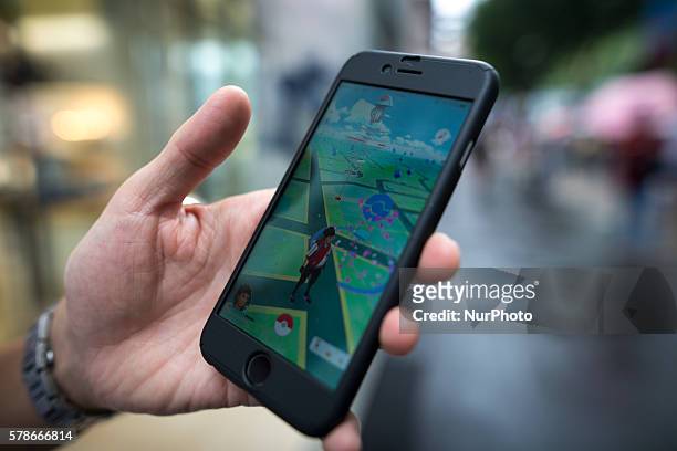 Pokemon players plays in the street of Omotesand as Pokemon Go finally launches in Japan for the first day, Tokyo, Japan on Friday, July 22, 2016....