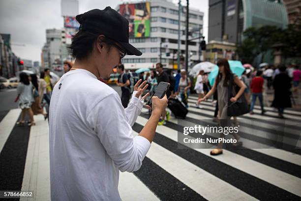 Pokemon players plays in the street of Omotesand as Pokemon Go finally launches in Japan for the first day, Tokyo, Japan on Friday, July 22, 2016....