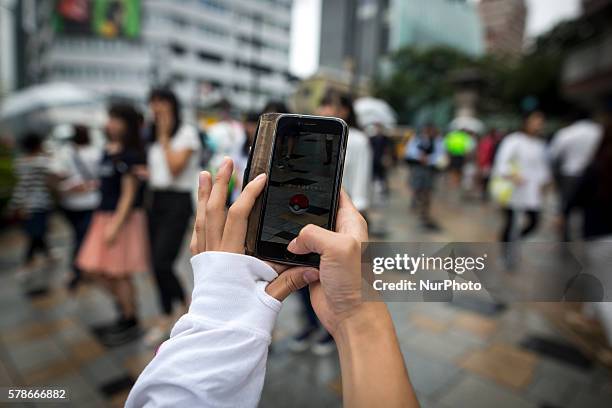 Pokemon players plays in the street of Omotesand as Pokemon Go finally launches in Japan for the first day, Tokyo, Japan on Friday, July 22, 2016....