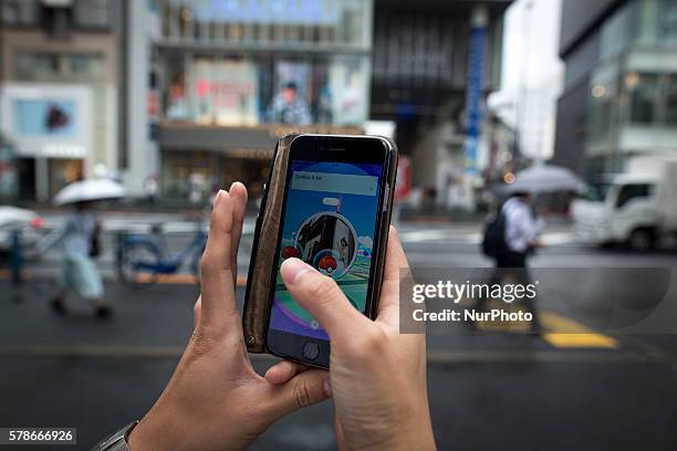 Pokemon players plays in the street of Omotesand as Pokemon Go finally launches in Japan for the first day, Tokyo, Japan on Friday, July 22, 2016....