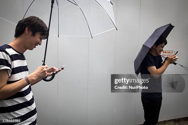 Pokemon players plays in the street of Omotesand as Pokemon Go finally launches in Japan for the first day, Tokyo, Japan on Friday, July 22, 2016....