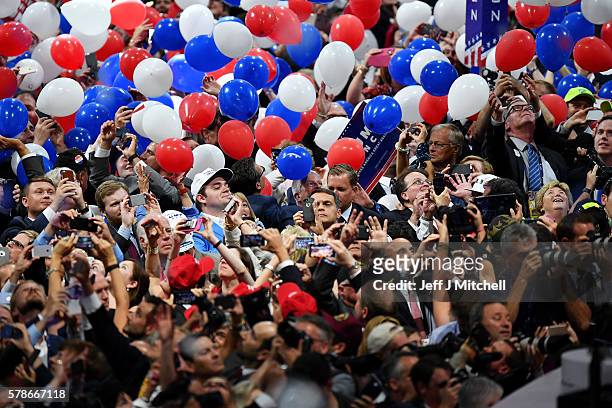 Delegates stand and cheer at the end of the Republican National Convention on July 21, 2016 at the Quicken Loans Arena in Cleveland, Ohio. Republican...
