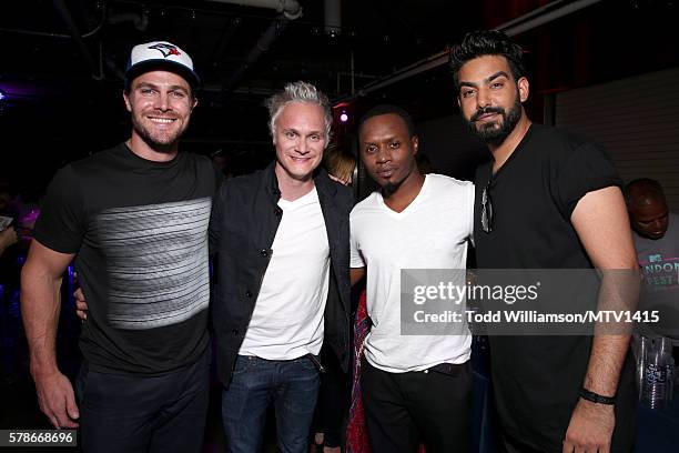 Actors Stephen Amell, David Anders, Malcom Goodwin and Rahul Kohlie pose backstage at the MTV Fandom Awards San Diego at PETCO Park on July 21, 2016...