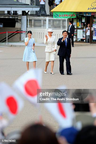 Princess Aiko, Crown Princess Masako and Crown Prince Naruhito wave to well-wishers on arrival at Kashihara Jingu Station after visiting the the...
