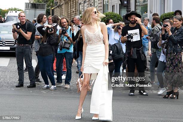 Elena Perminova leaves the Christian Dior Haute Couture Fall/Winter 2016-2017 show as part of Paris Fashion Week on July 4, 2016 in Paris, France.