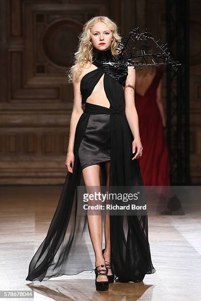 Model walks the runway during the On Aura Tout Vu Haute Couture Fall/Winter 2016-2017 show as part of Paris Fashion Week on July 4, 2016 in Paris,...