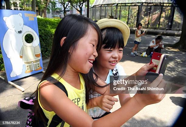 Children play Pokemon Go at the Tennoji Zoo on July 22, 2016 in Osaka, Japan. Japanese players started downloading "Pokemon Go" following earlier...