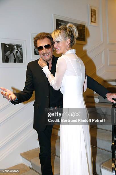 Singer Johnny Hallyday and his wife Laeticia attend the Christian Dior Haute Couture Fall/Winter 2016-2017 show as part of Paris Fashion Week on July...