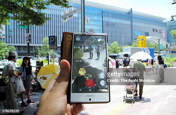 Pokemon Go player at Hakata Station on July 22, 2016 in Fukuoka, Japan. Japanese players started downloading "Pokemon Go" following earlier releases...