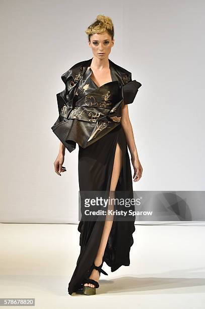 Model walks the runway during the Patuna Haute Couture Fall/Winter 2016-2017 show as part of Paris Fashion Week on July 4, 2016 in Paris, France.