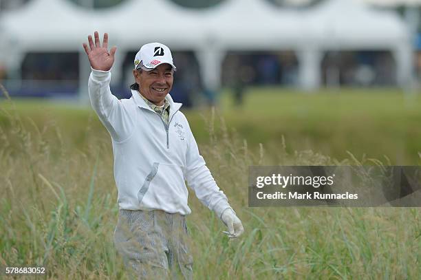Kohki Idoki of Japan waves as he walks from the 2nd tee during the second day of The Senior Open Championship at Carnoustie Golf Club on July 22,...